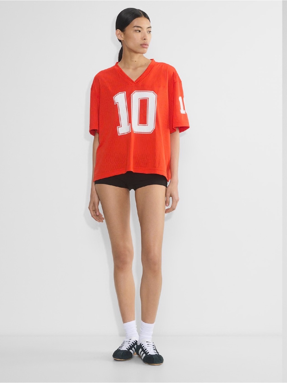 Aritzia TNA Court Mesh Endgame Jersey Size L in the color Poppy Red/ White